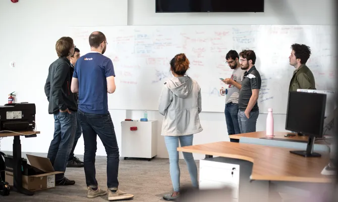 Ahrefs team collaborating in their office