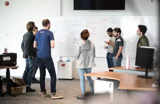 Ahrefs team collaborating in their office