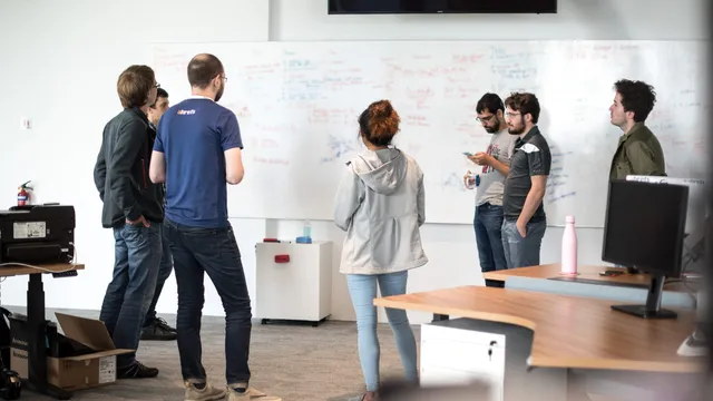 Ahrefs team collaborating in their office